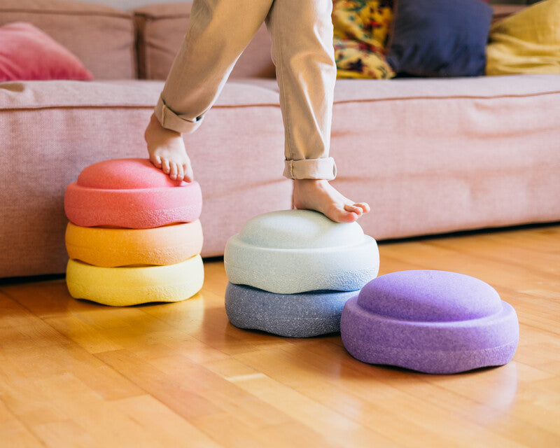 Kid is balancing over Original rainbow pastel