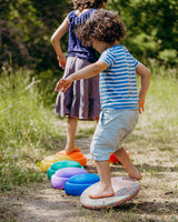 children are balancing over stapelstein rainbow set classic path