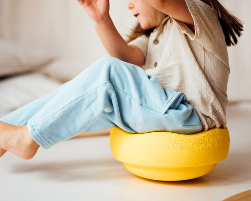 Kid spins in Original yellow